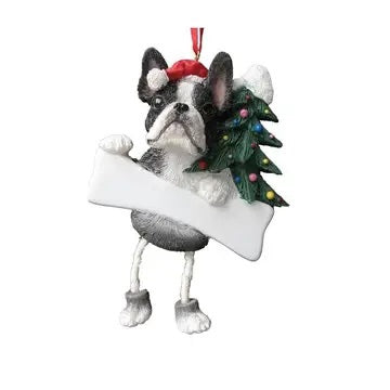 A dangling Boston Terrier ornament with a red scarf and a Christmas tree decoration.